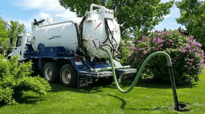 Professional vacuum truck performing residential drainage and septic maintenance in Tempe, AZ